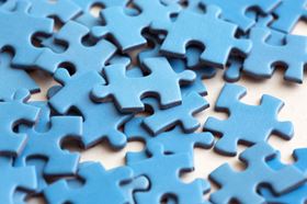 Blue Puzzle Pieces Scattered On Top Of Each Other 