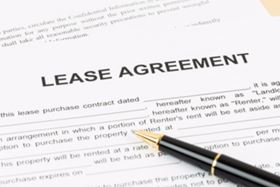 A Lease Agreement Contract with A Pen On Top 